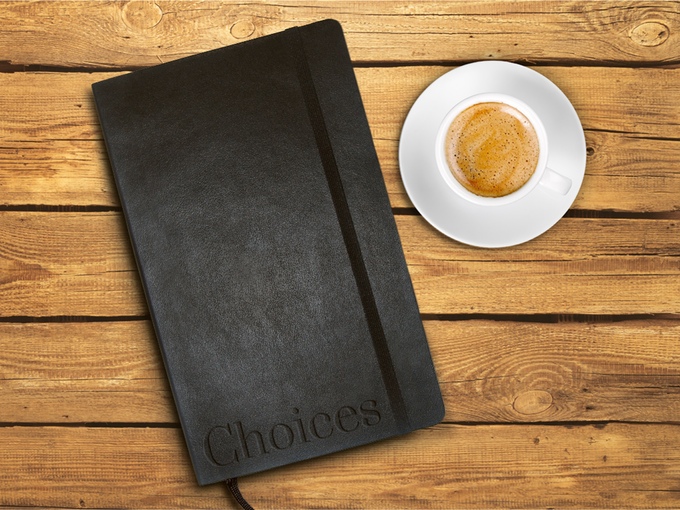 Choices notebook with coffee